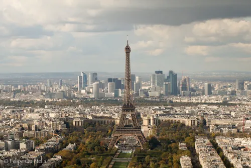 The Eiffel Tower, seen from the Montparnasse building, with the La Defense Paris neighborhood in the background