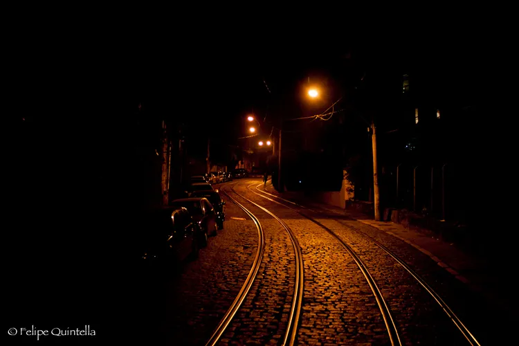 Windy roads and street cable car tracks of the Lapa neighboorhood during the night